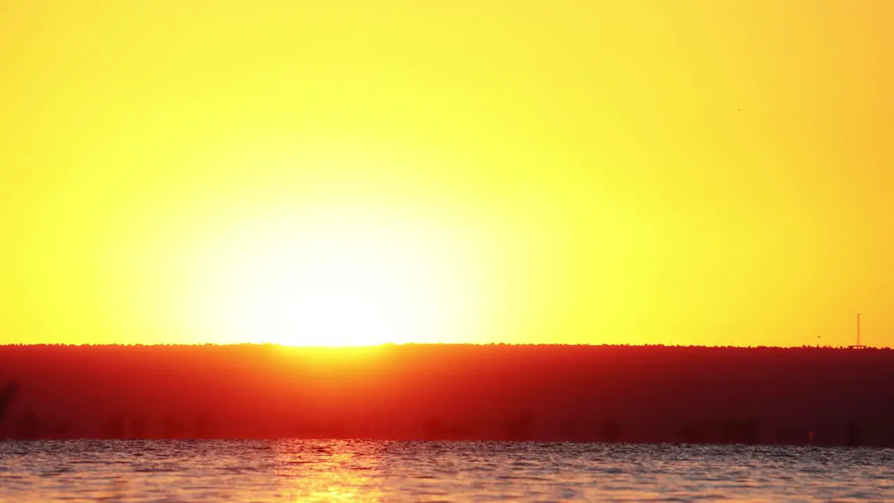 Beautiful Warm Colors Of Sunrise Over Tranquil Water