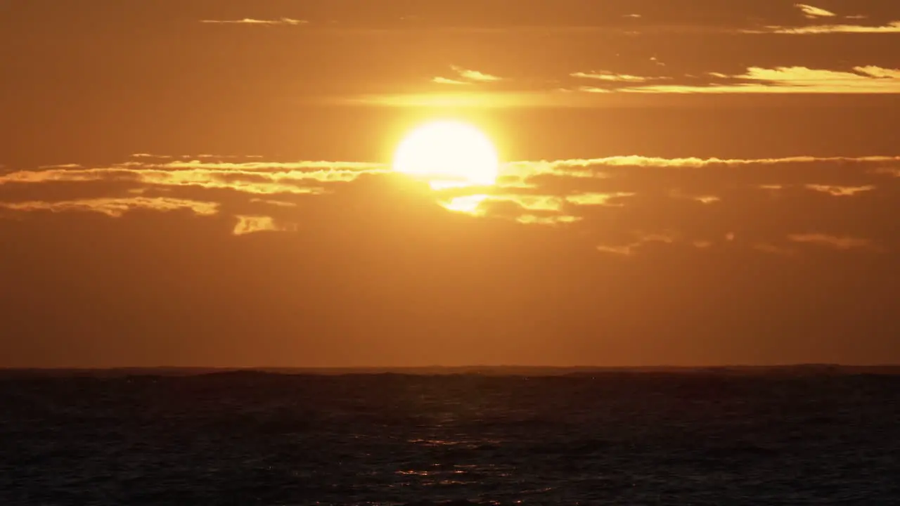 Pan shot of sunrise above the Skagerrak ocean on Justoya island on a sunny morning in Aust-Agder Norway