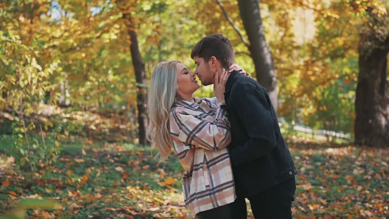 Young Man In Love Gives A Kiss On The Nose To His Girlfriend