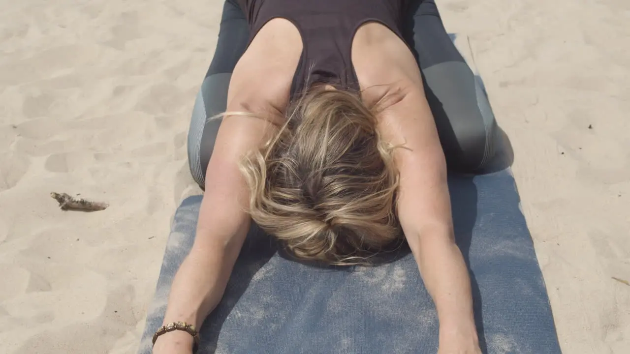 Close up of woman in sleeping swan yoga pose