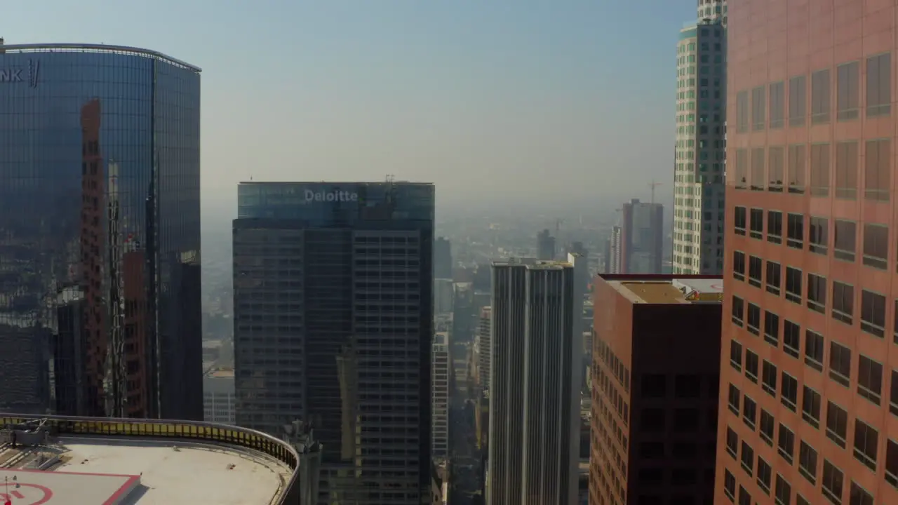 Passing huge brown colored Skyscraper office buildings in Downtown Los Angeles Skyline Scenic Aerial dolly forward