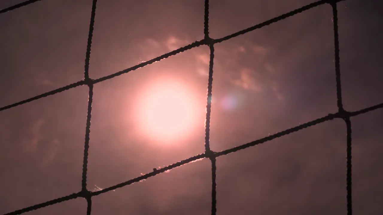 Volleyball net on a sand background close-up