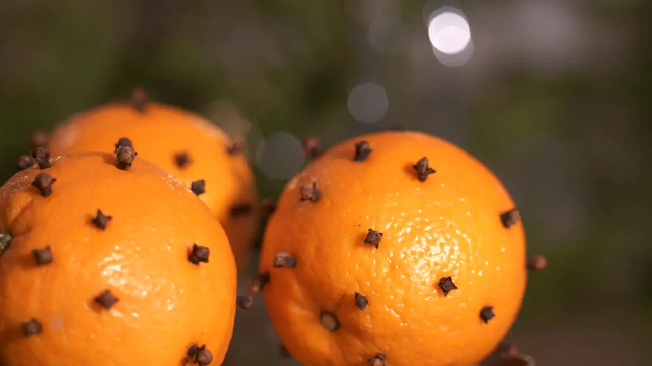 Whole oranges with cloves stuck in the peel