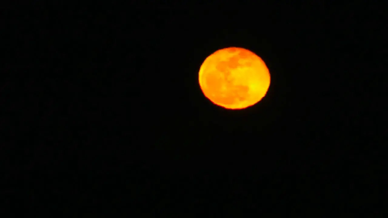 A time lapse of the yellow and orange moon