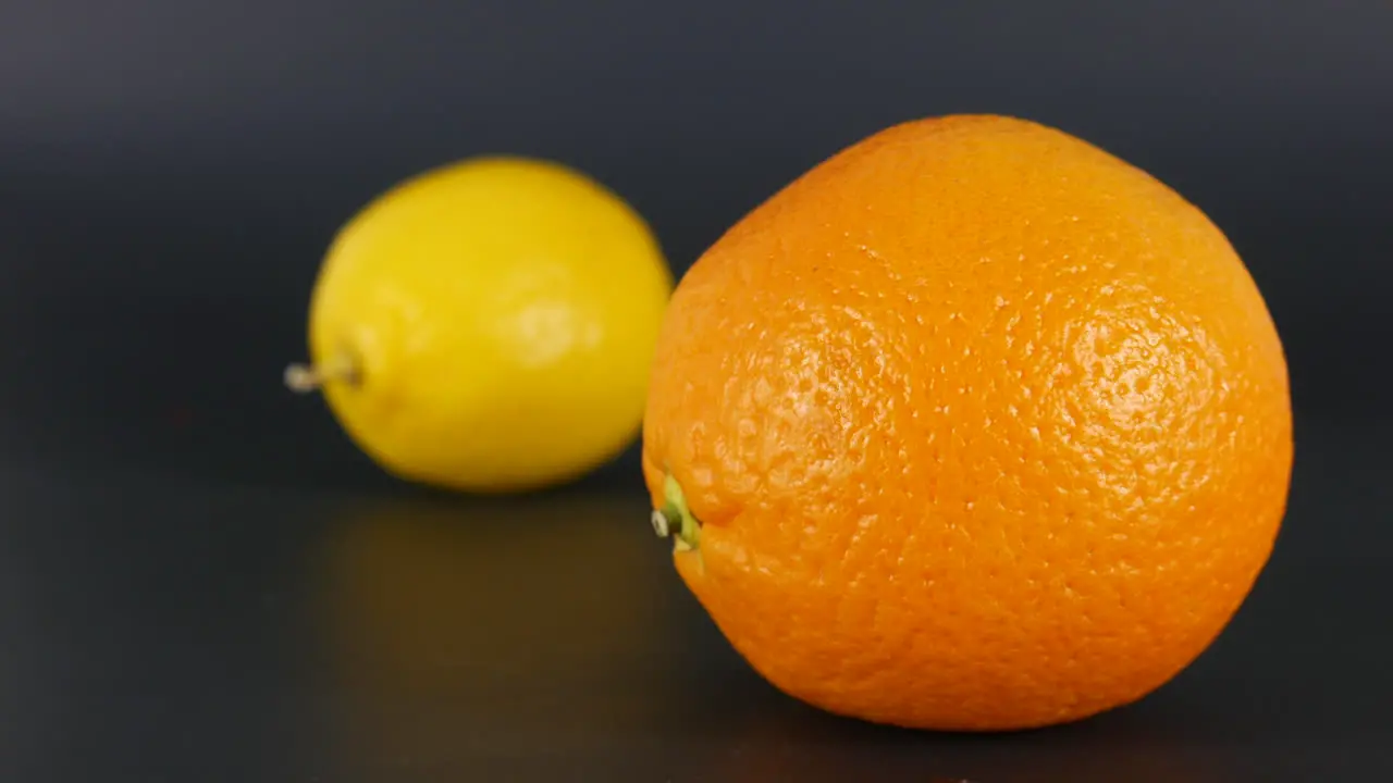 Orange fruit focus vs lemon in background citrus food fresh juicy vitamin vegetables macro studio shot illustration nutrition colorful dessert aliment fruits