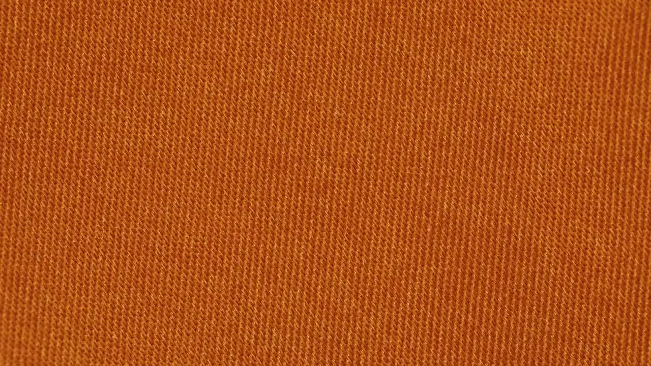 Tangerine Color Plain Textured Fabric Closeup Shot