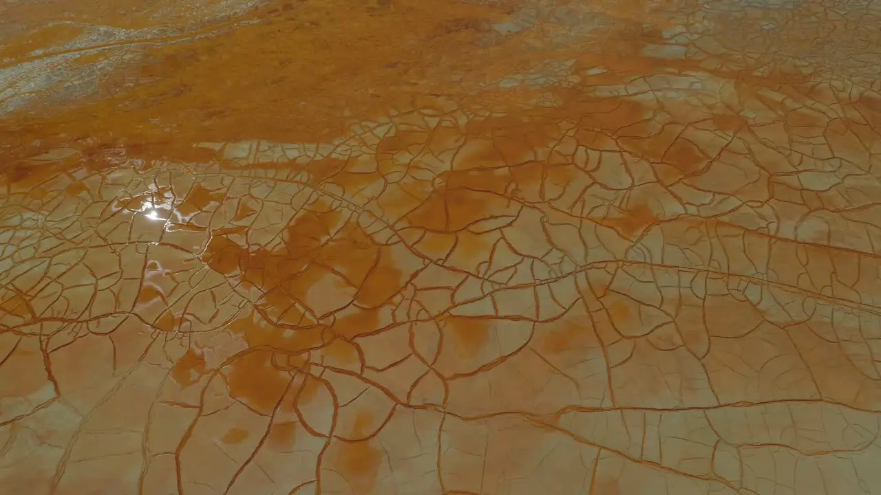 Aerial view of the cracked and wet surface