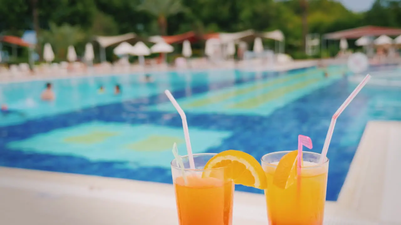 A Luxurious Holiday For Two Lovers Two Glasses With An Orange Cocktail On The Background Of A Huge P