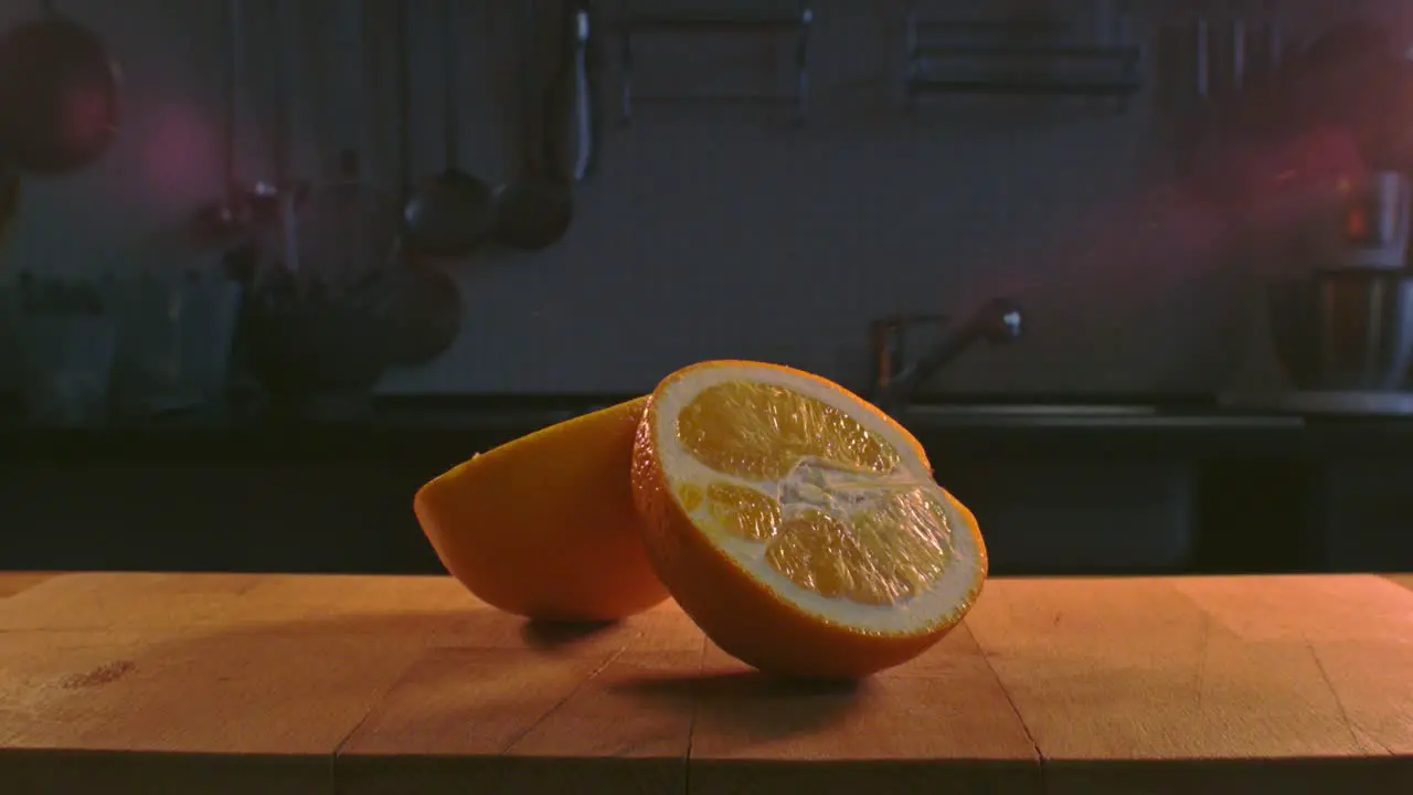 Light shining orange halves Orange cut in half Orange slice on wooden table