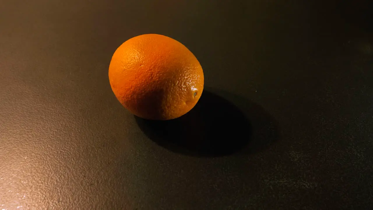 Orange Spinning until Stop on the Kitchen Counter