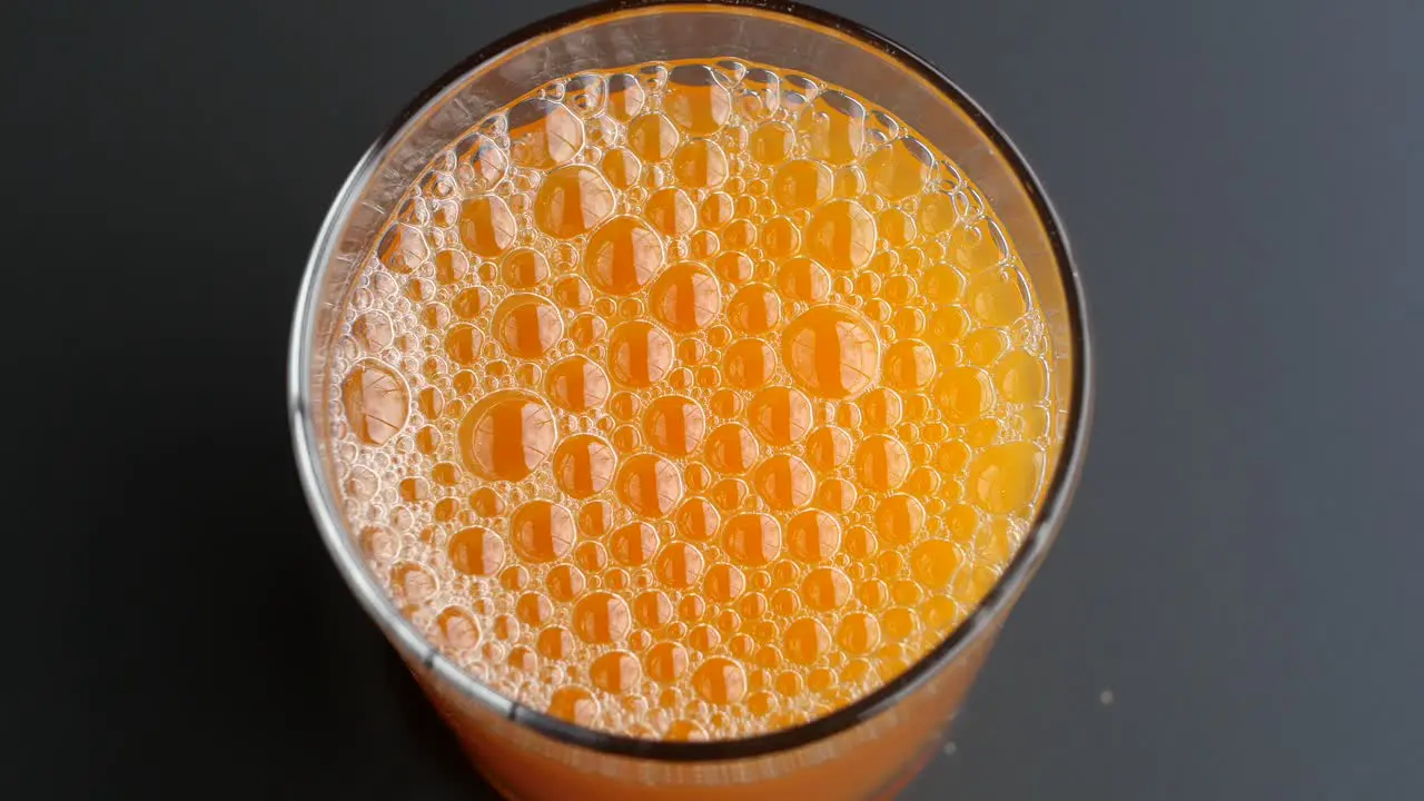 Orange juice in glass on table 