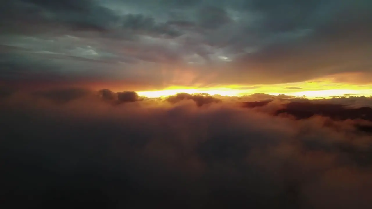 Artistic Natural Scenery Orange Sun Rays Gleaming Through Dark Clouds At Sunset 4K Drone