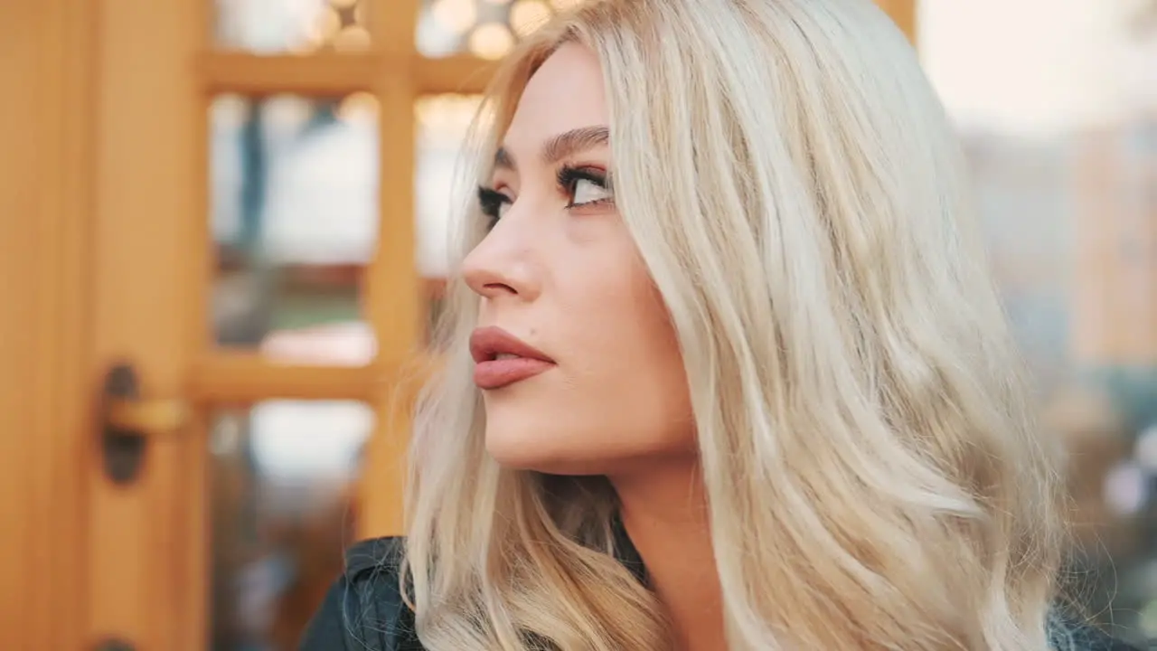 Portrait Of Pretty Young Blonde Woman Smiling In Makeup With Lipstick Looking At Camera