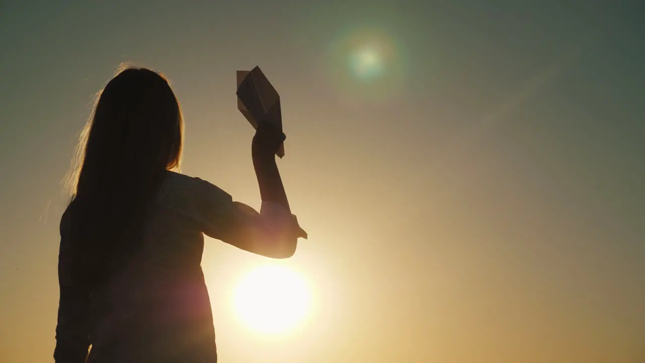 Silhouette Of Little Girl Playing With Toy Airplane At Sunset Child Dreams Of Travel Concepts 4K Vid