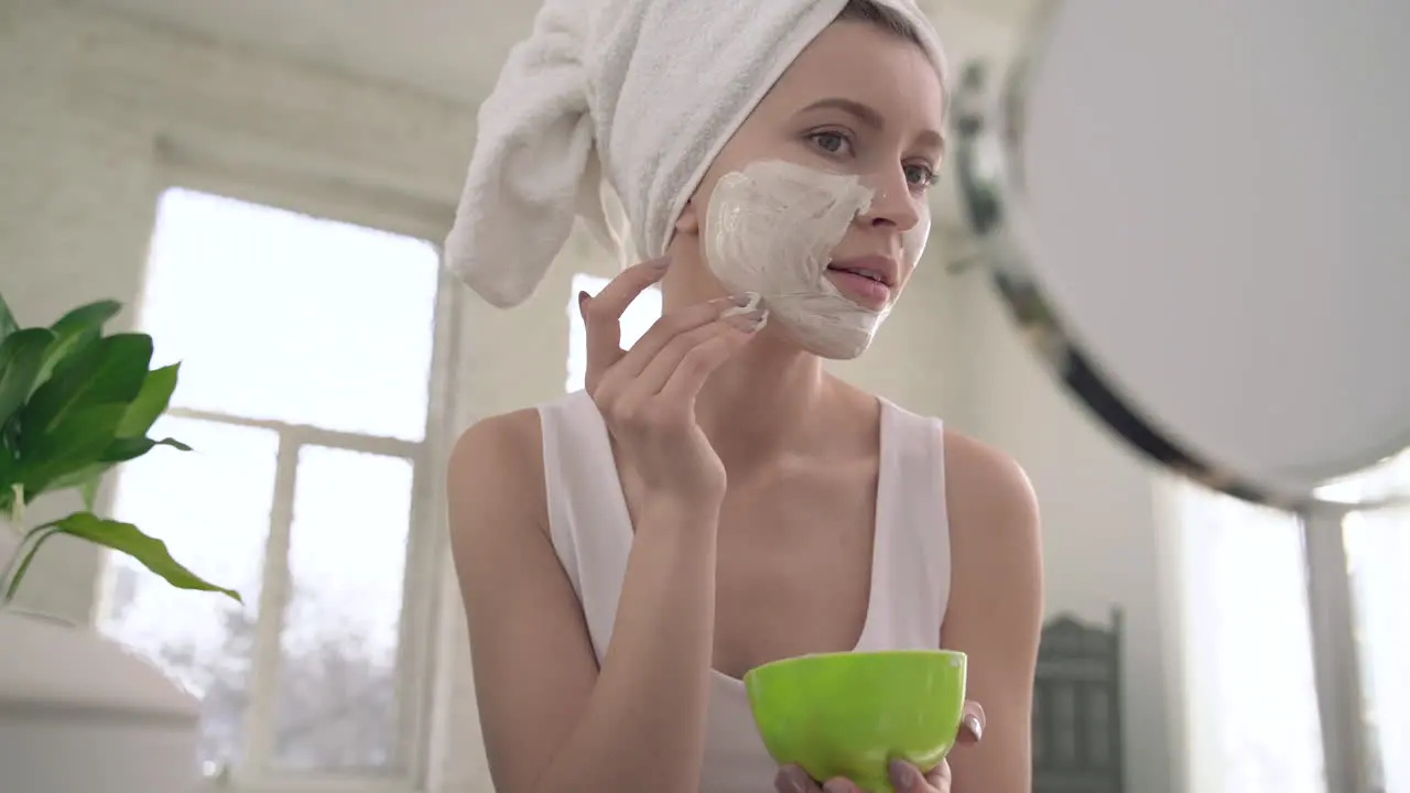 Woman Applying Scrub For Skin Care