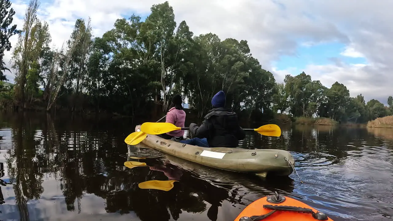 Kayaking adventure and people rowing in the lake