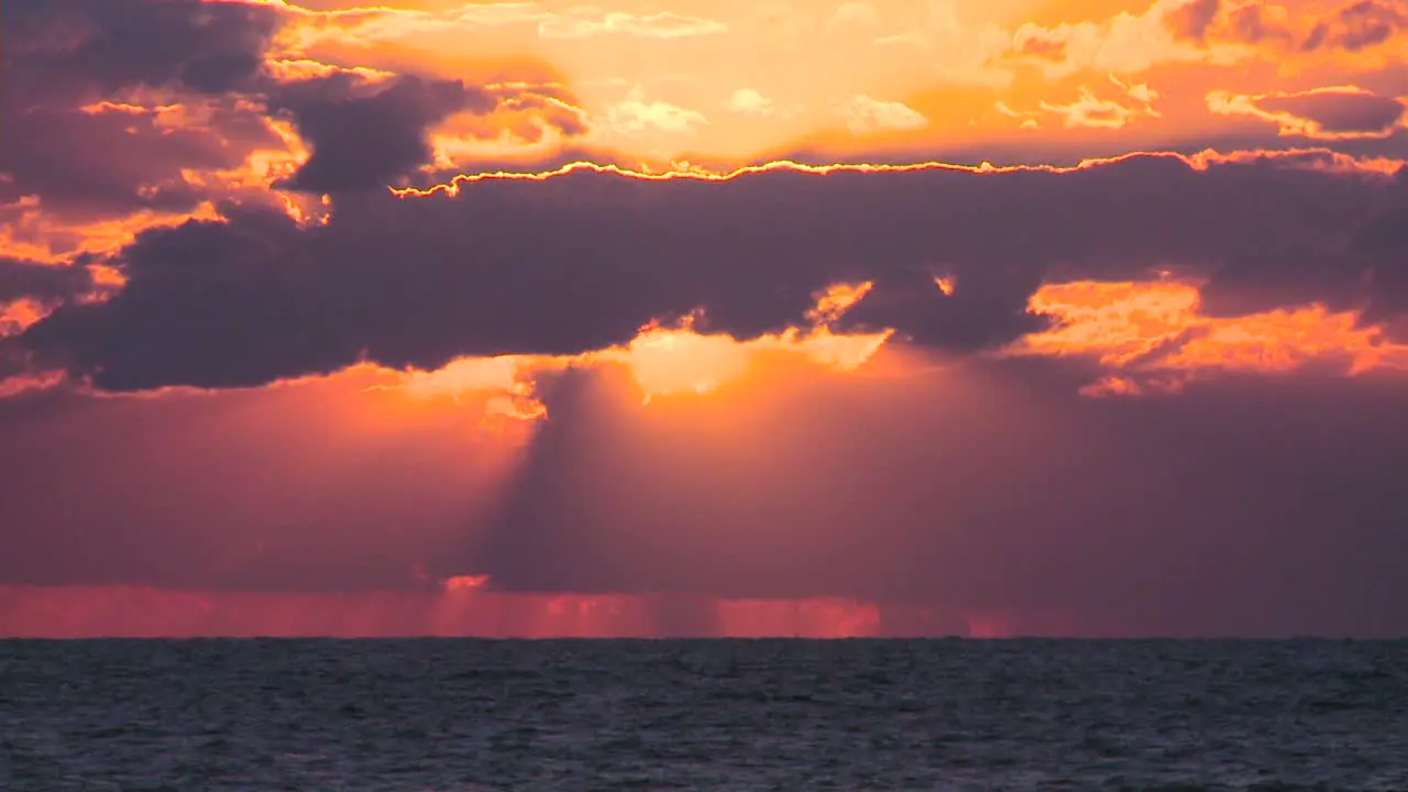 A beautiful red and orange sunset behind the ocean