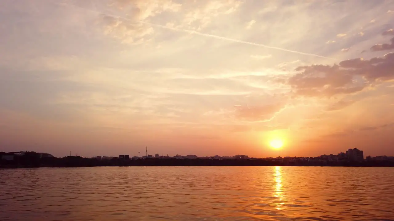 Traveling By Boat In A Lake During Sunset