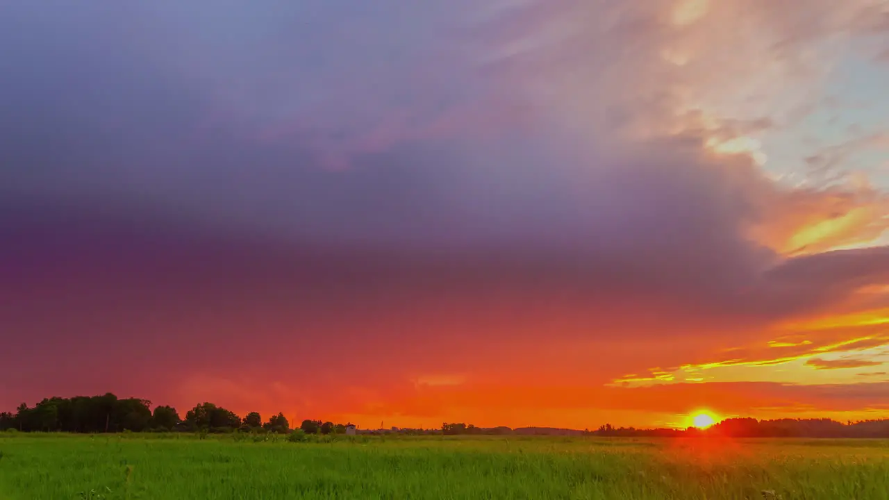 Colorful Sunset Sky Over Green Fields On The Countryside