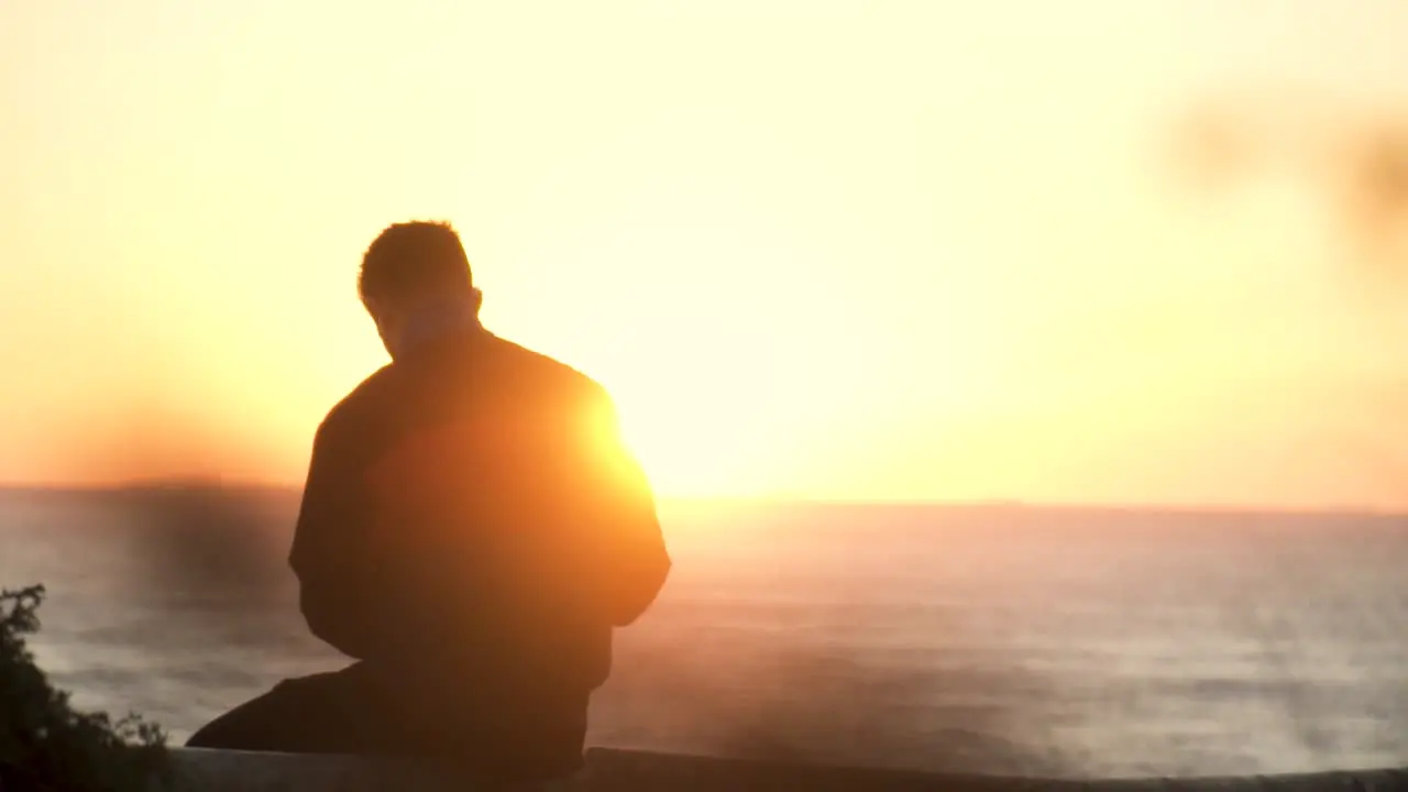 Slow Motion Shot Of Man Watching Sunset In Front Of Sea View Cadiz Spain