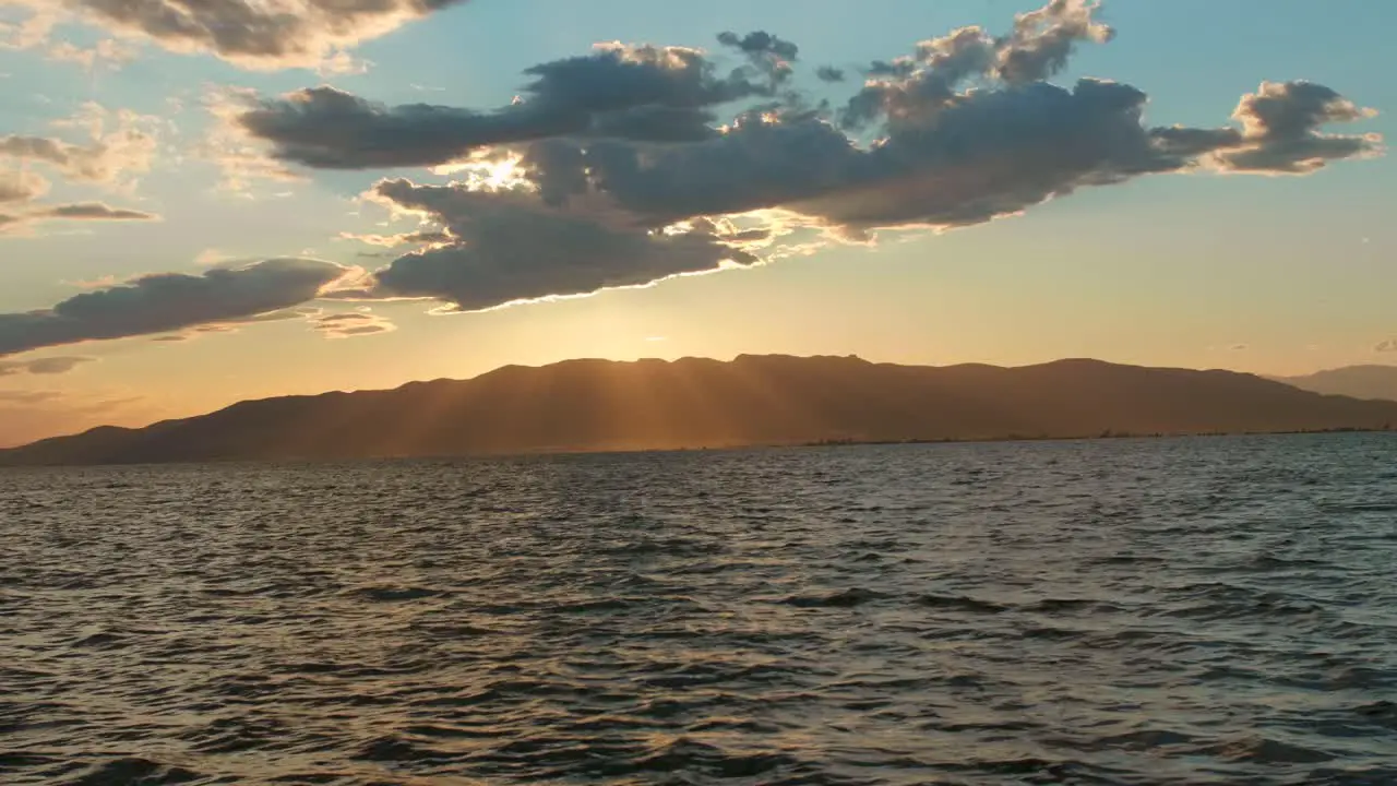 Beautiful Sunset View Of The Ocean And Serra de Montsia Mountains From Ebro Delta Catalonia Spain wide shot