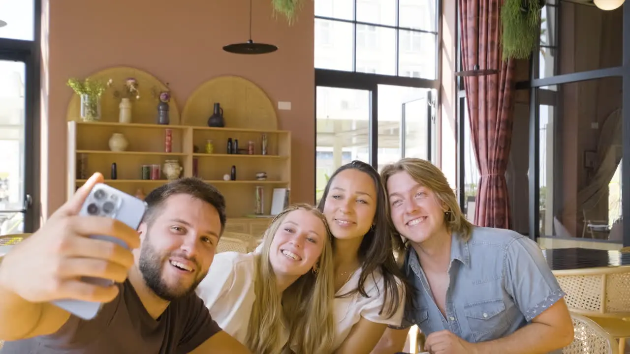 Group Of Friends Taking A Selfie Photo And Having Fun While Eating Pizza In A Restaurant