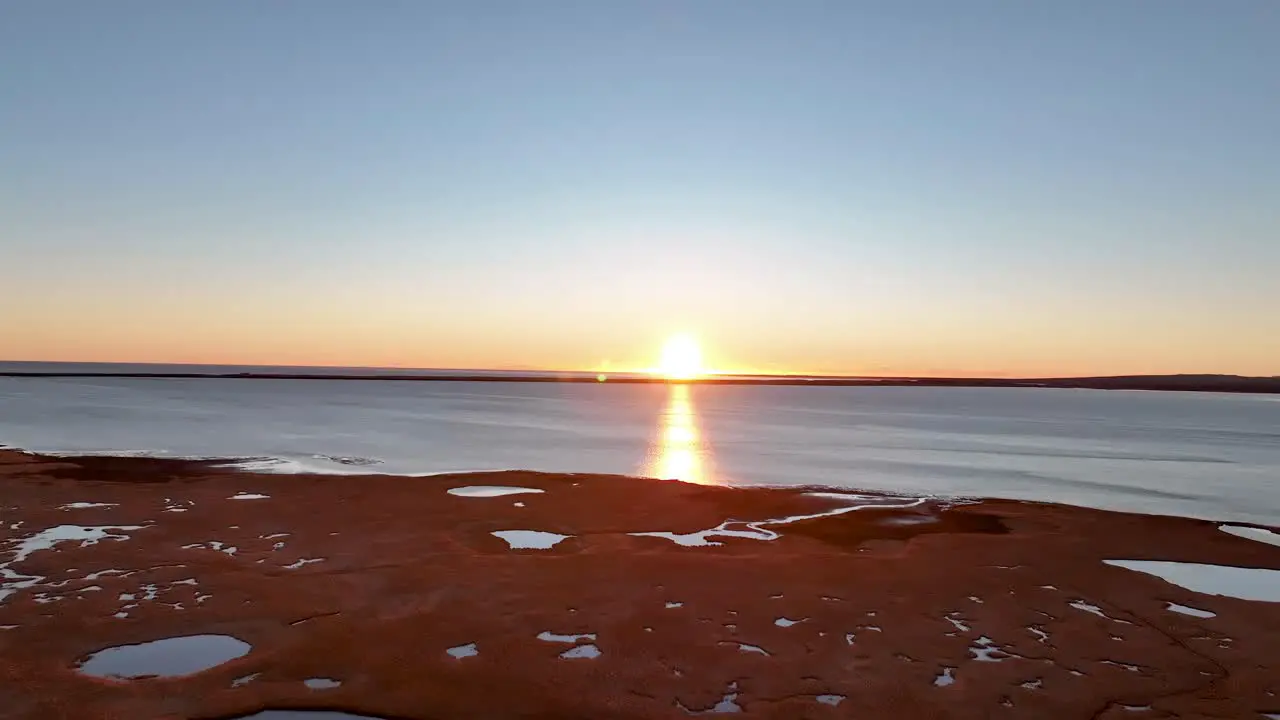 Beautiful Sunset Reflecting On Calm Ocean Water In South Iceland During Low Tide