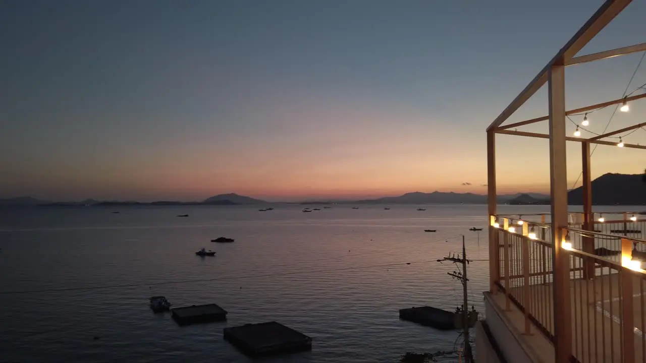 Establishing view of Suncheon Bay from balcony at sunset