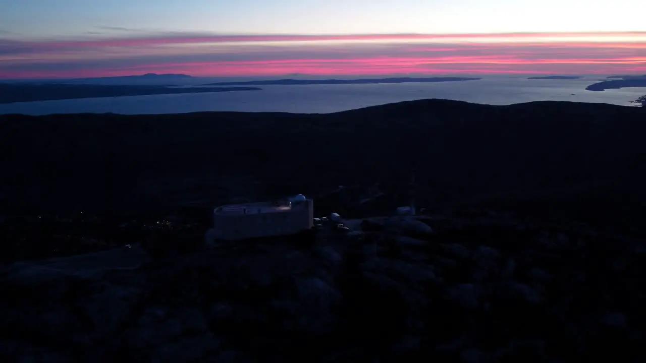 A beautiful view of the sunset and the observatory on the mountain