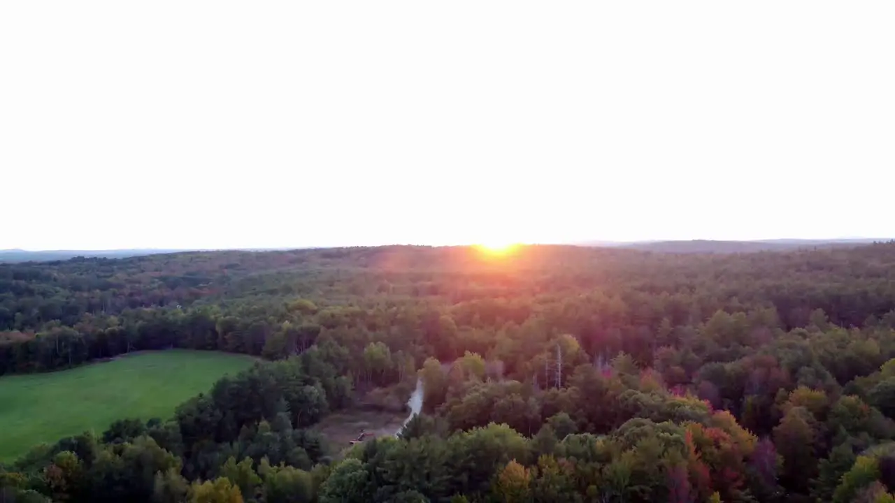 A long pan down of a forest and pond in Hallowell Maine