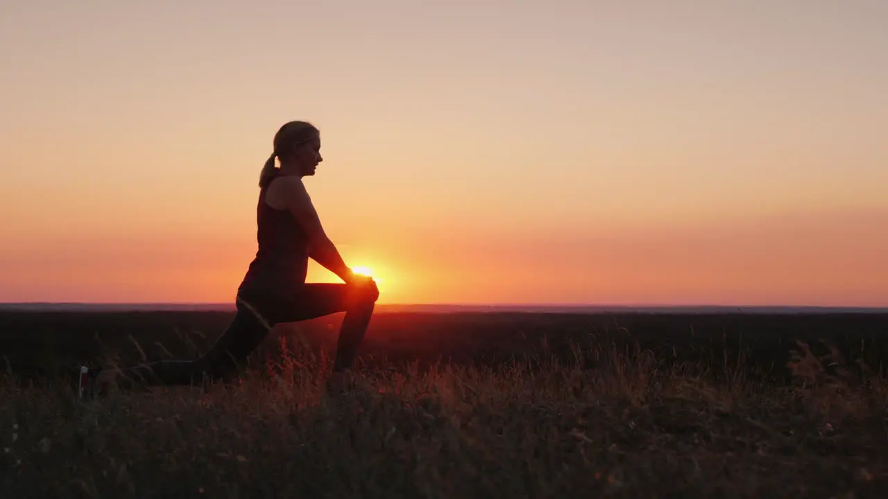 Mom And Her Adult Son Play Sports Together In A Beautiful Sunset Setting