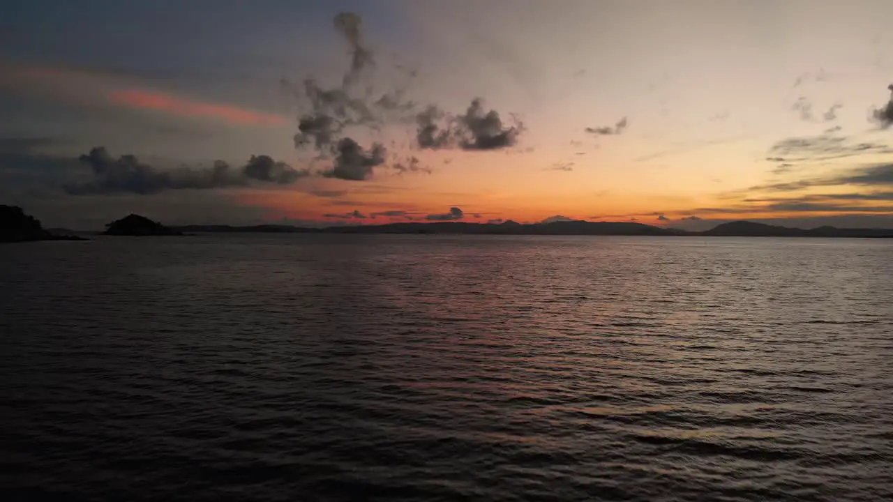 Dramatic Drone Beautiful Sunset in Paradise Island Sunset over ocean waves wash sand beach