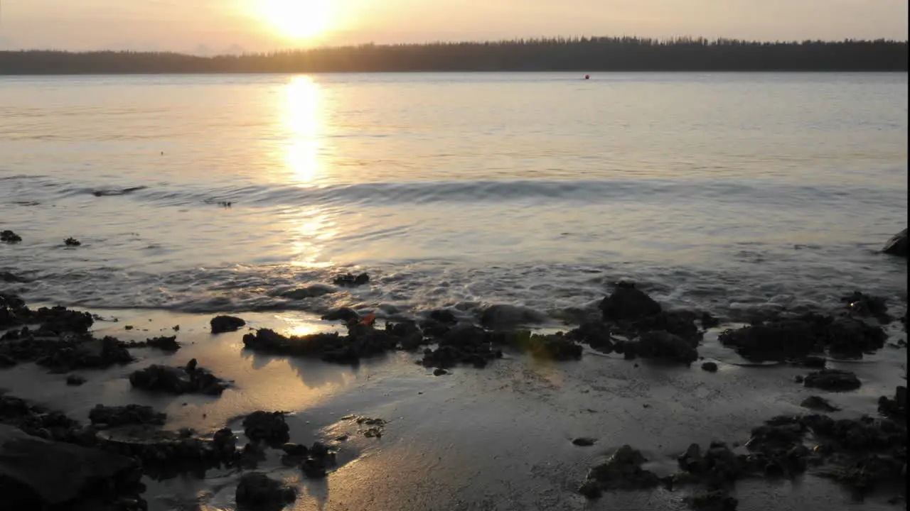 Time lapse of the sun setting into Bartlett Cove in Glacier Bay National Park Alaska