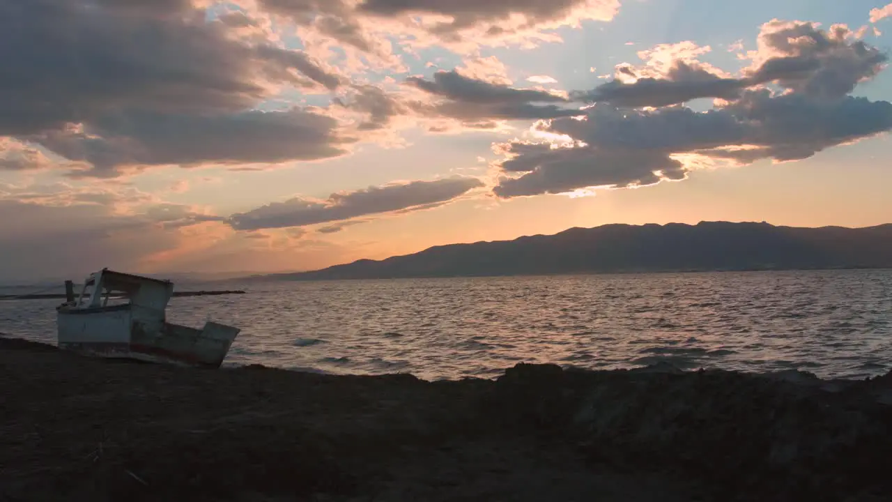 Boat Wreck At The Beach With Scenic Ocean At Sunset