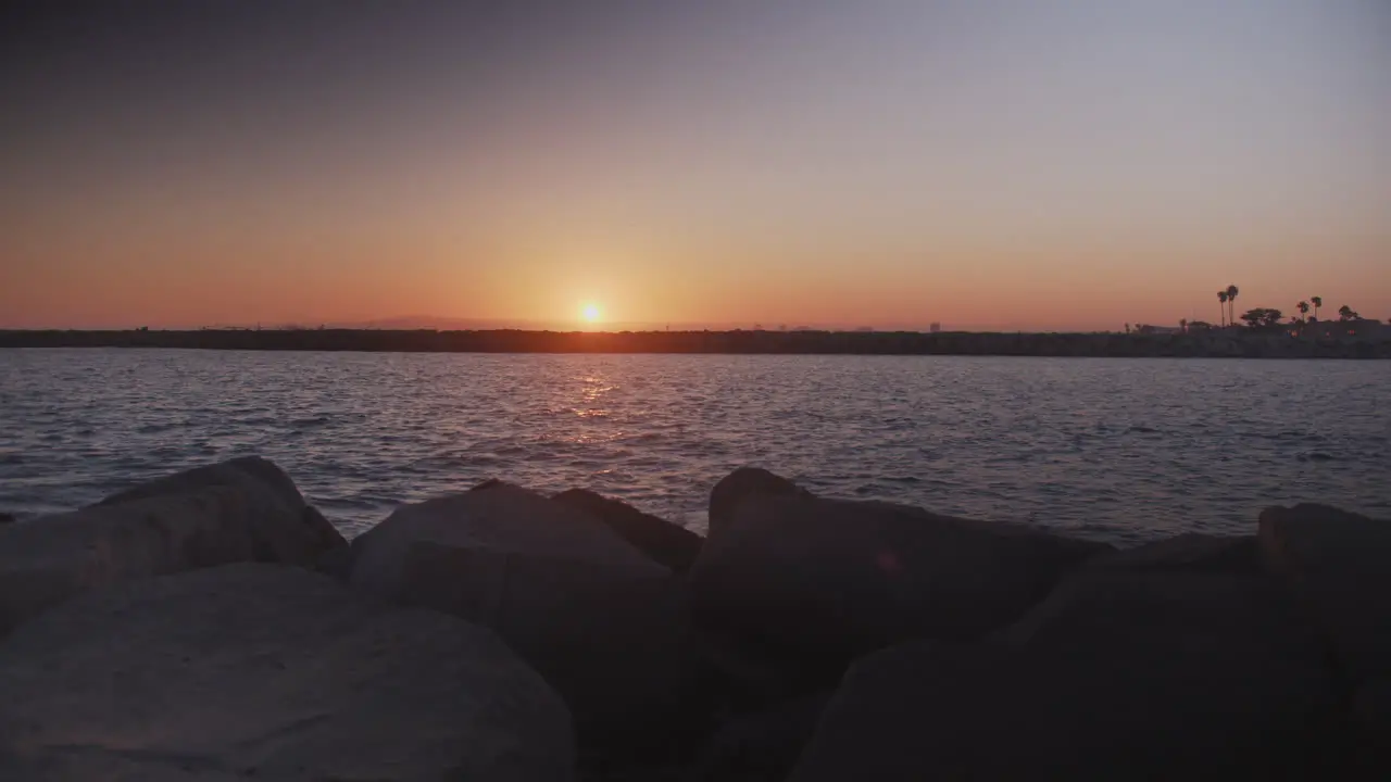 Purple and orange sunset over a Pacific channel