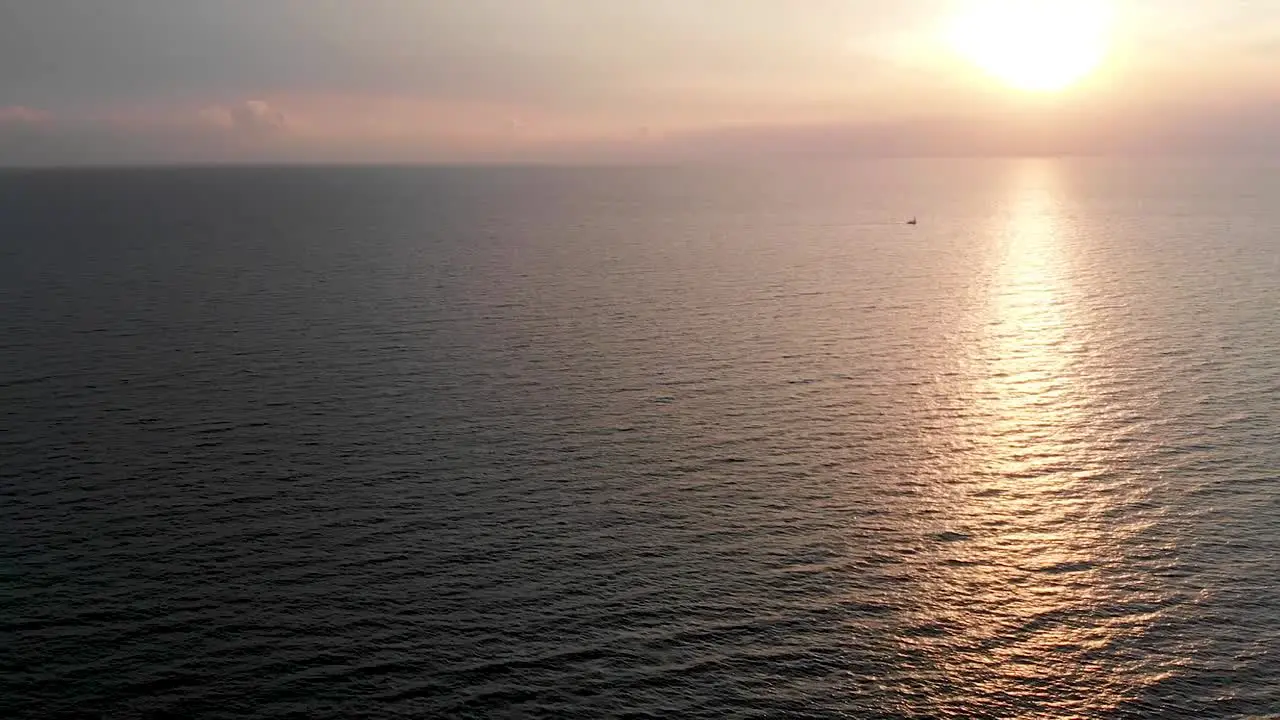 Turning aerial view of a sunset over the sea