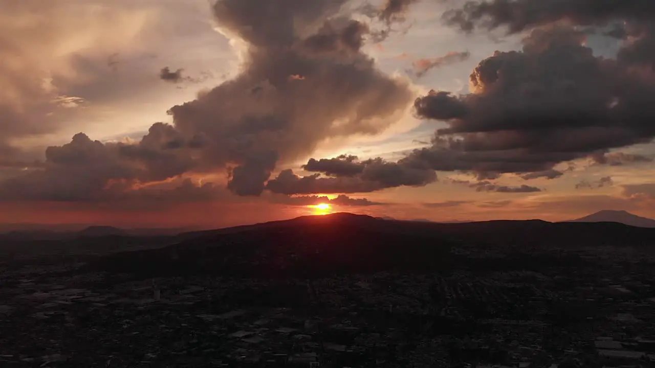 Aerial sunset over the city with clouds