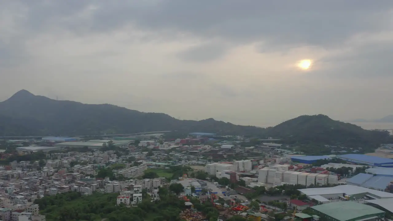 drone shot of a countryside's village with a sunset