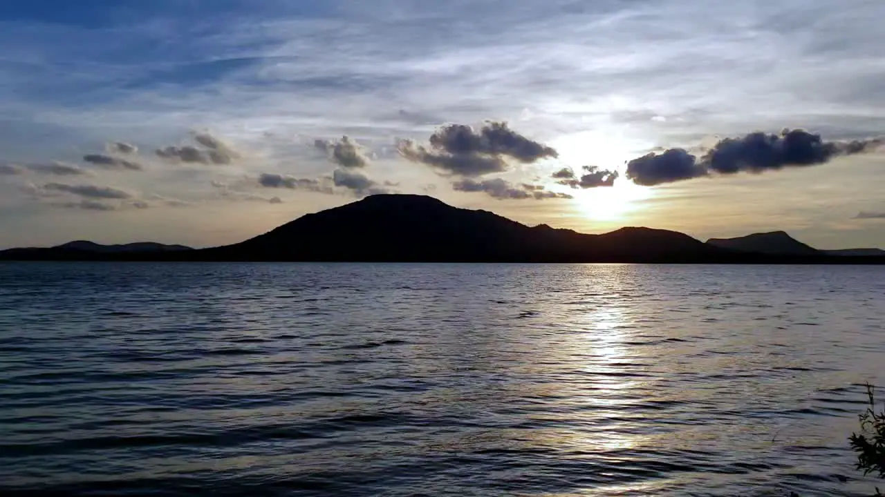 Beautiful sunset scenery with water lake clouds and sky