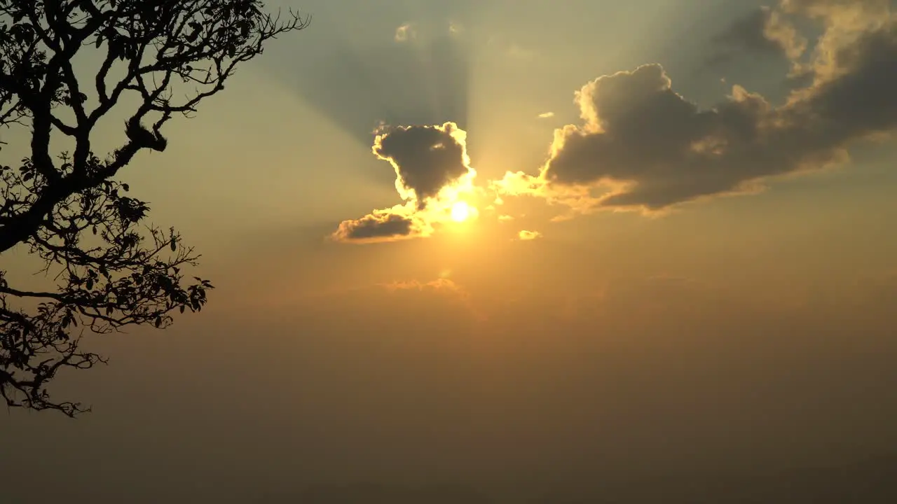 sun going behind the clouds on sunset in Thailand view from Mountain