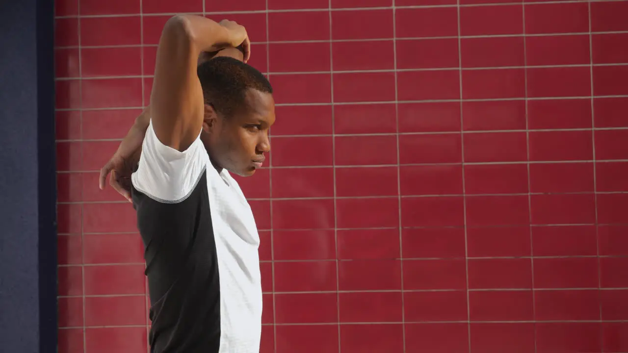 Young Black Man Stretching Before Running Outdoors 2