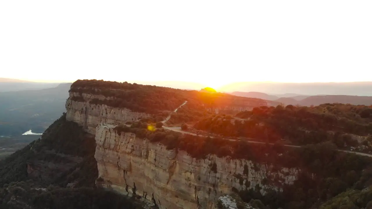 Aerial sunset in the mountains gold hour