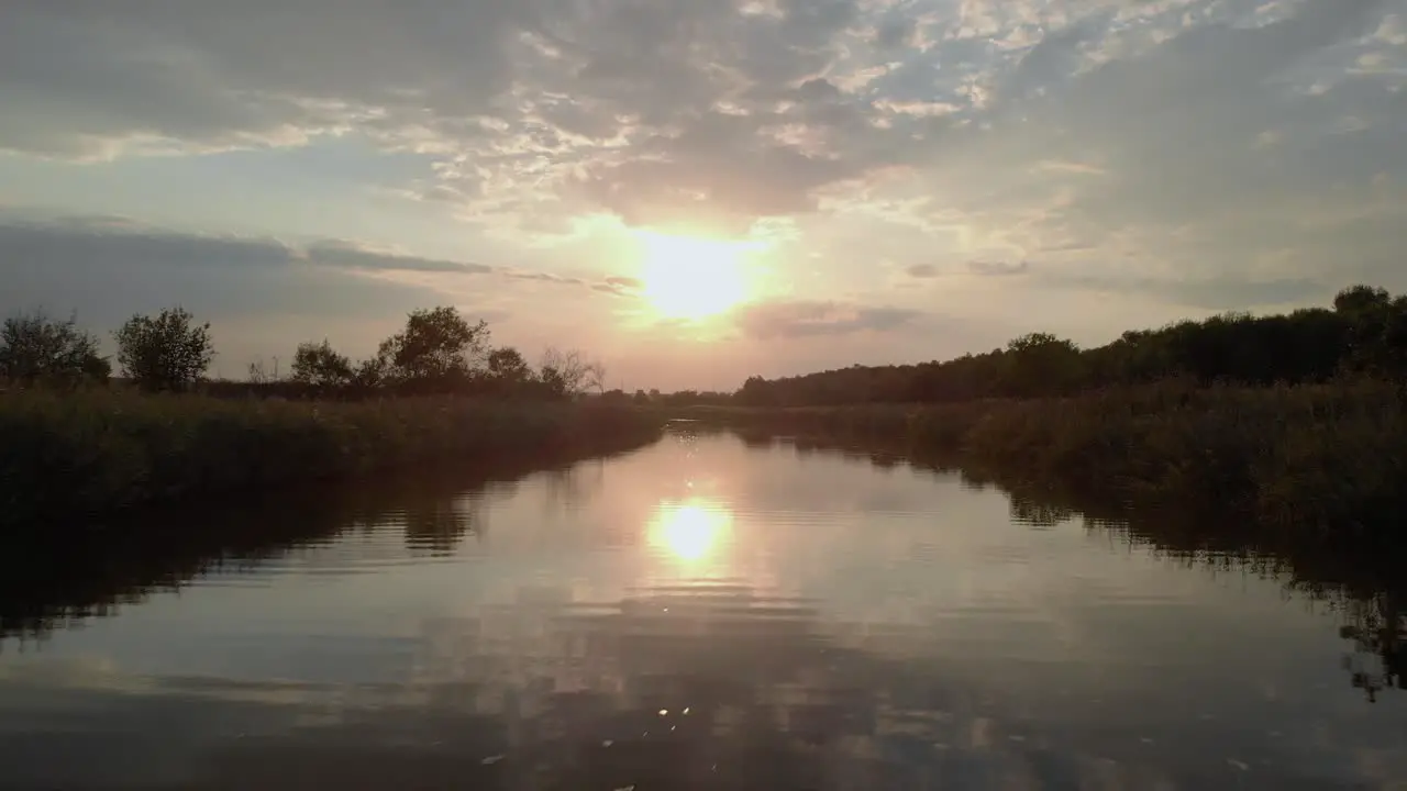 Low drone shot close to the river fly upstream