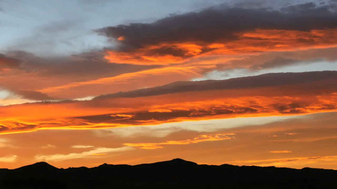 New Zealand Moeraki Sunset Wave Clouds Over Hills