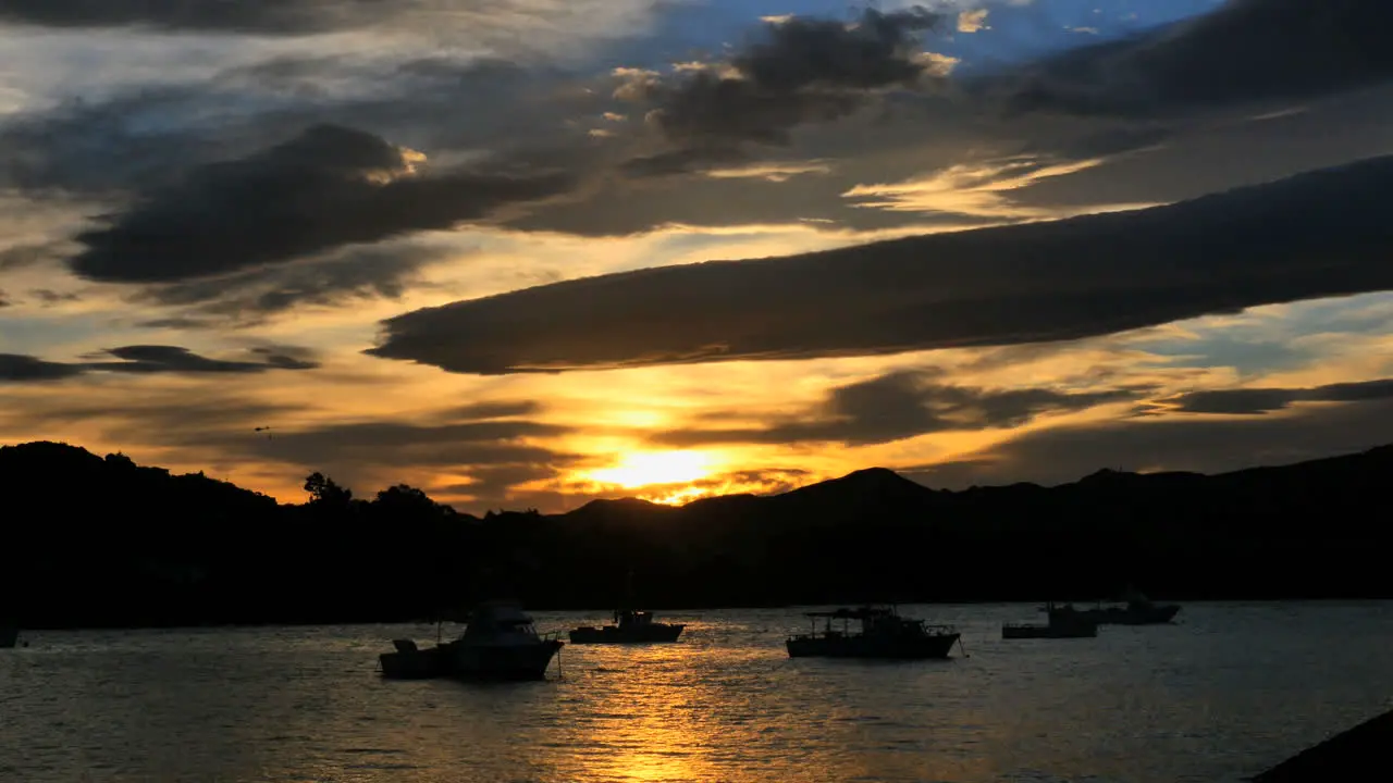 New Zealand Moeraki Boats At Sunset Under Wave Cloud