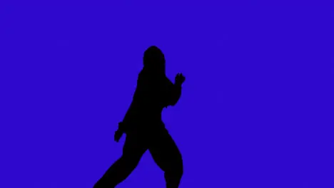 Studio Silhouette Of Woman Dancing Against Blue Background 1