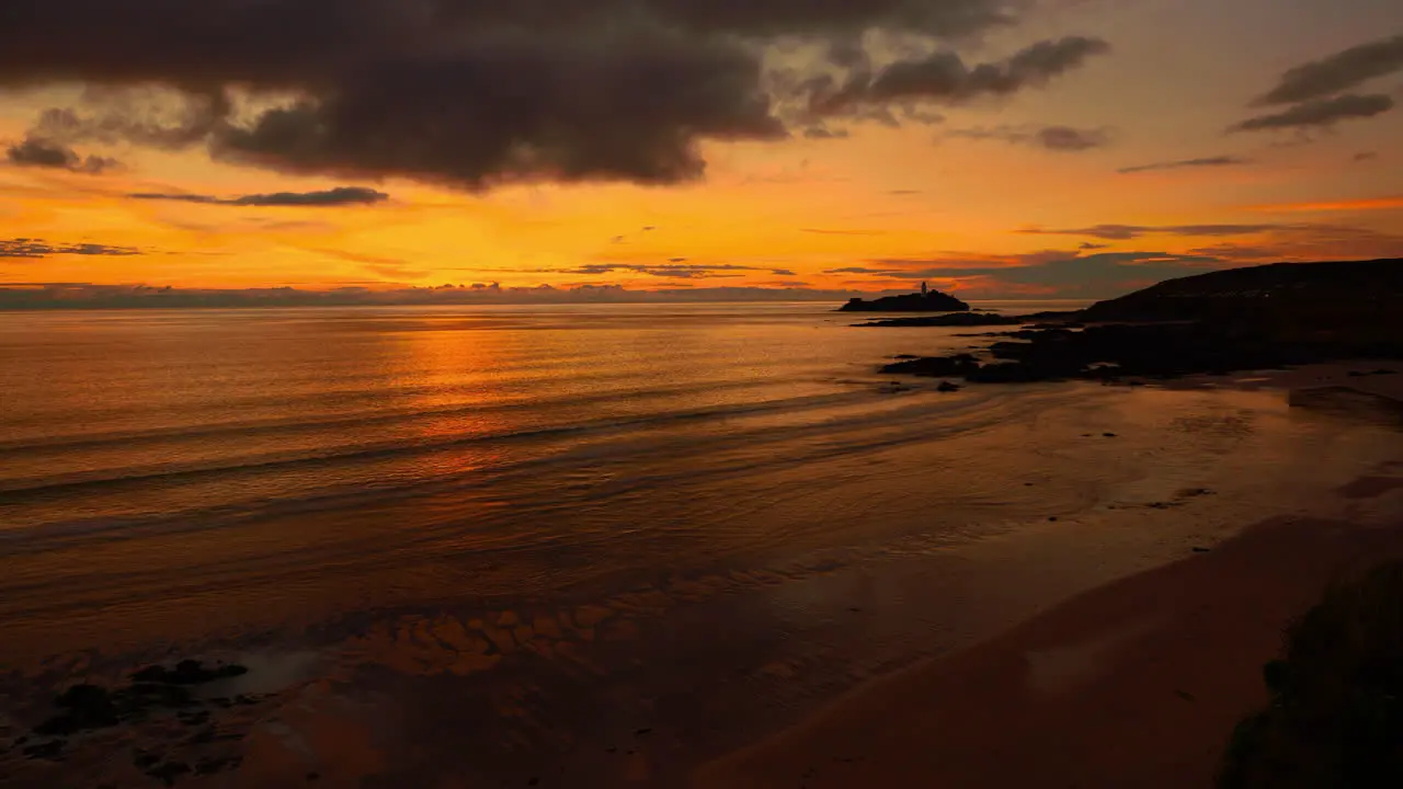 Cinemagraph seamless video loop of a calm sunset evening seaside beach close to St Ives in Cornwall England UK