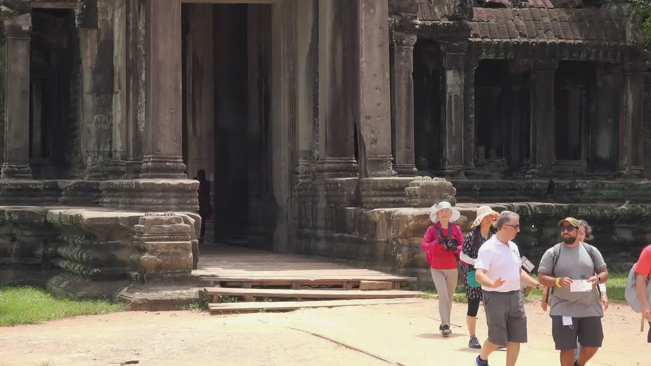 Tourist Coming Out of the Temple at Angkor Wat