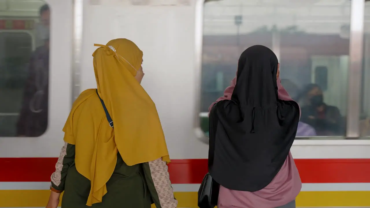 Mid Shot of Women Waiting for Train in Jakarta