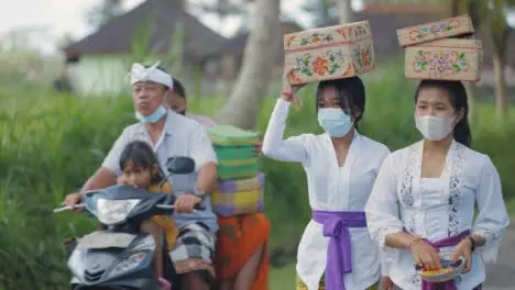 Mid Shot of Women Carrying Things on Their Head in Bali